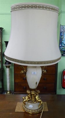 Lot 486 - A large gilt metal mounted table lamp featuring putti, 54cm high excluding fitting