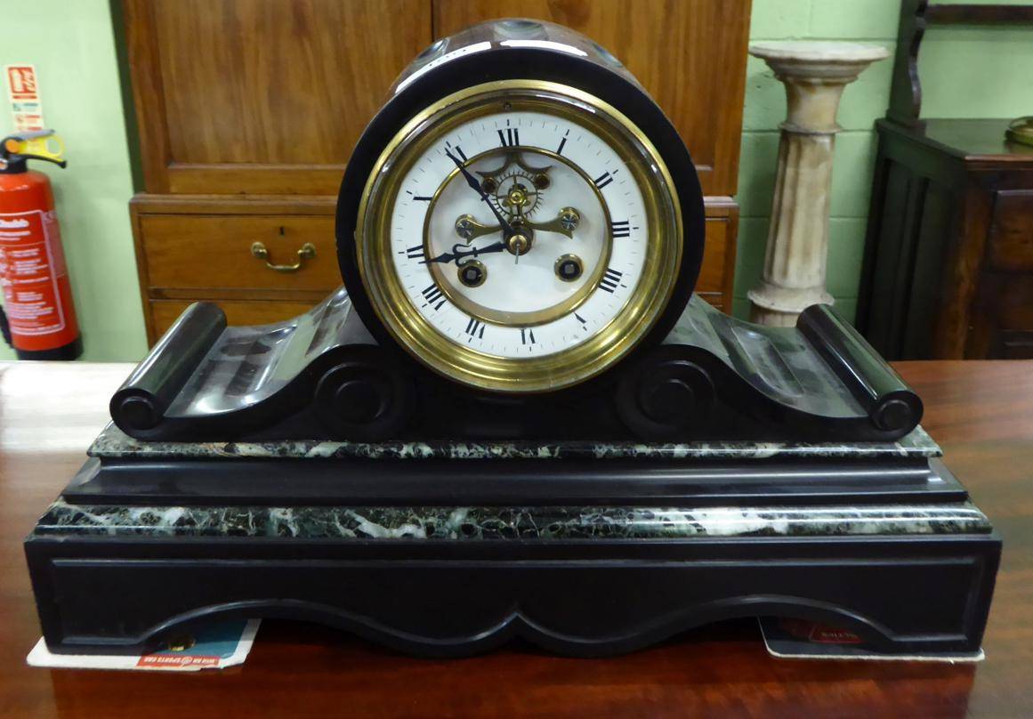 Lot 489 - A black slate and marble striking mantel clock