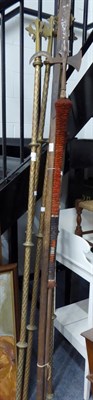 Lot 1028 - Four brass ecclesiastical ceremonial rods with cross terminals, three various spears and a halbard