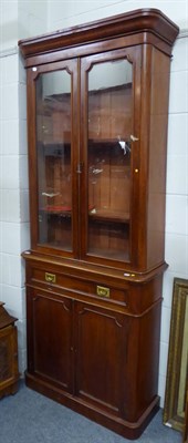 Lot 1040 - A Victorian mahogany bookcase cabinet