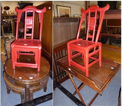 Lot 1043 - An Oriental carved nest of tables; a pair of red Chinese child's chairs; and a mahogany butlers...