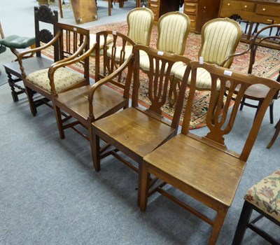 Lot 1067 - A carved oak side chair, two similar carver chairs one with solid seat, two dining chairs with...