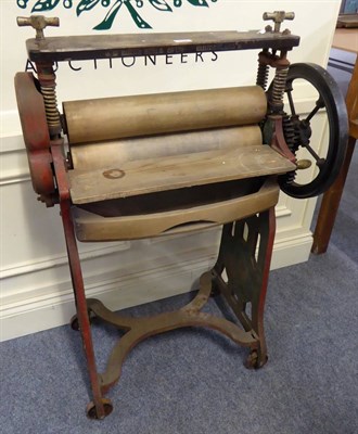 Lot 1069 - A large cast iron mangle and 'Taywill' hero machine, stamped 'H Binns Son & Co Ltd, Sunderland'