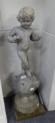 Lot 1080 - A lead garden fountain as a putto on a grape decorated base