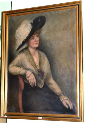 Lot 1129 - Henry Kingworth Raine (1872-1934), Portrait of a lady, seated half length, in a feathered wide...