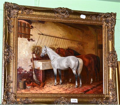 Lot 1134 - 20th Century School in the manner of J.F.Herring, Horses feeding in a stable, oil on board,...