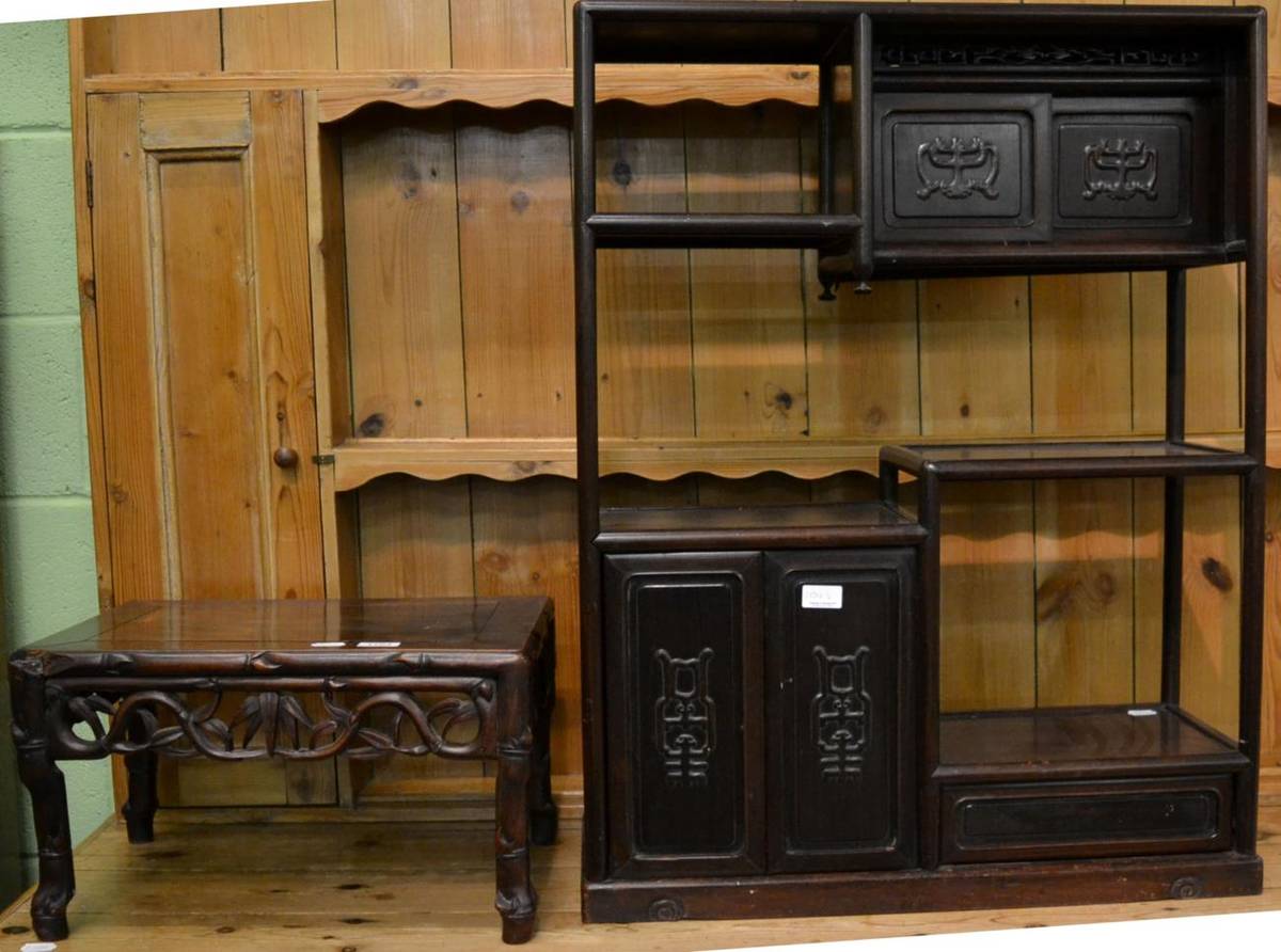 Lot 1154 - A Chinese hardwood low table together with an Oriental hardwood display shelf with an...