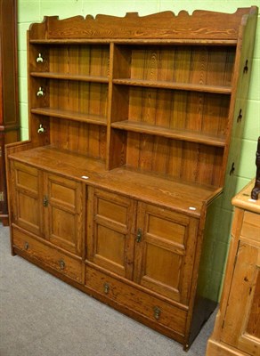 Lot 1155 - An oak dresser and rack with trefoil cut outs