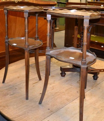 Lot 1165 - A pair of two tier side tables on outswept supports