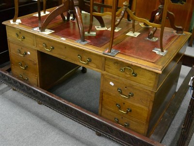 Lot 1167 - A 20th century twin pedestal desk with leather inset top on cabriole ball and claw supports,...