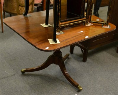 Lot 1171 - A 19th century mahogany tilt top supper table, on ring turned stem and reeded supports
