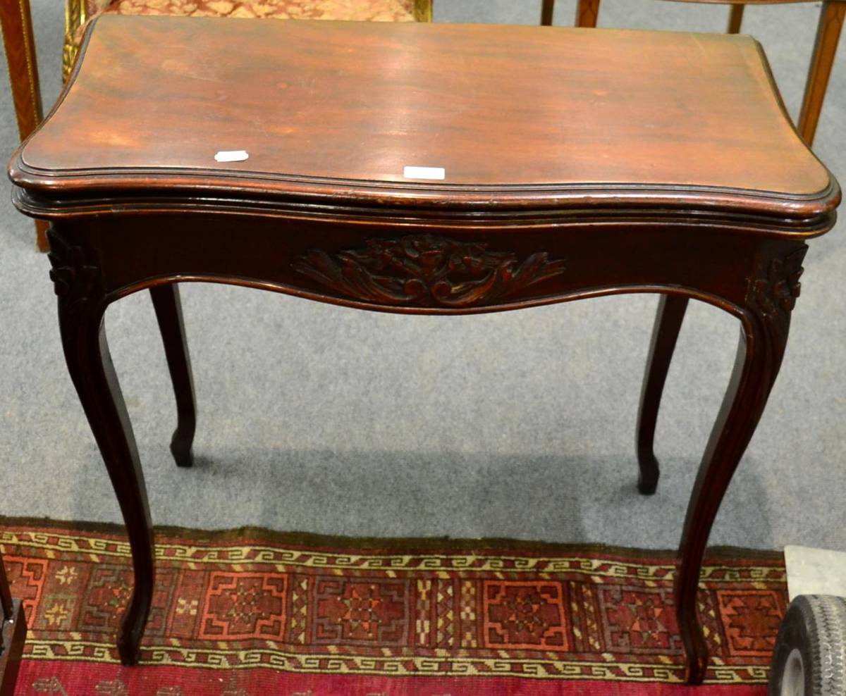 Lot 1179 - A Continental mahogany serpentine foldover table