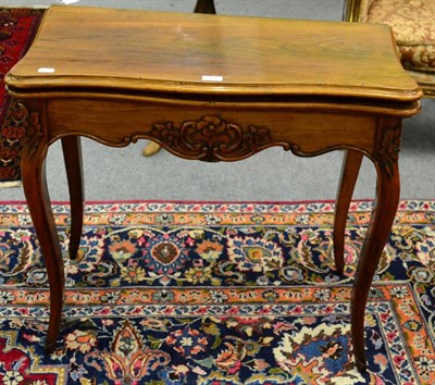 Lot 1182 - A Continental rosewood serpentine foldover table