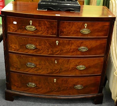 Lot 1184 - A mahogany four height chest of drawers, with spiralling fluted corners, on bracket feet, 102cm...