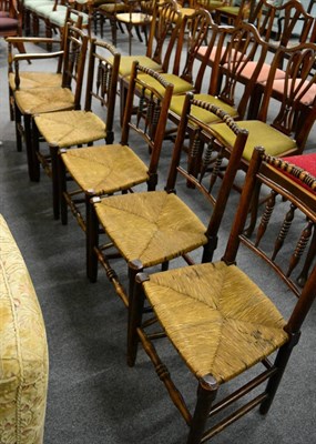 Lot 1194 - A set of five rush seat dining chairs with bobbin turned top rails together with a similar...