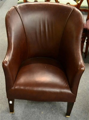 Lot 1201 - A leather upholstered tub chair