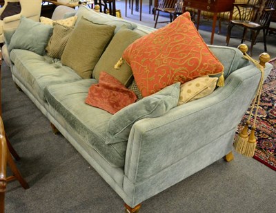 Lot 1211 - A large Duresta knoll type three seater sofa, blue upholstery, drop end, square supports to castors