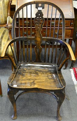 Lot 1215 - A 19th century wheel back Windsor armchair, with elm seat, cabriole legs and crinoline stretcher