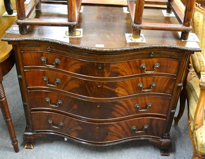 Lot 1222 - A mahogany serpentine fronted four height chest of drawers with brushing slide