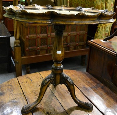 Lot 1232 - A George II style walnut scallop edge top tripod table, the moulded top decorated with...