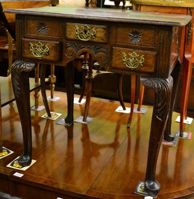 Lot 1241 - A George II joined oak dressing table, mid 19th century, the moulded top above three small...