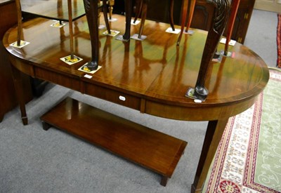 Lot 1242 - A George III style mahogany and cross banded D end dining table, with two leaves, winding...