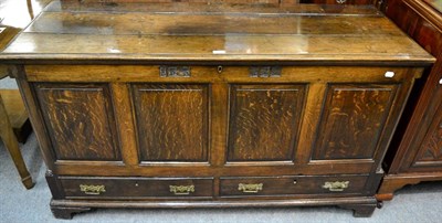 Lot 1244 - A George III joined oak mule chest, circa 1800, the hinged lid above four fielded panels, two...