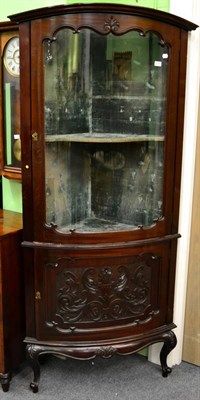 Lot 1255 - A late Victorian, carved mahogany, bow fronted and glazed standing display cabinet