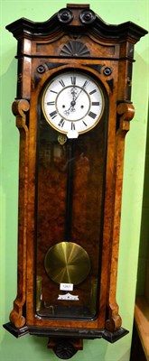 Lot 1261 - A walnut veneered double weight driven Vienna type wall clock