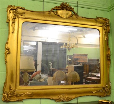 Lot 1270 - A large gilt gesso wall mirror with foliate decoration, 110cm by 125cm