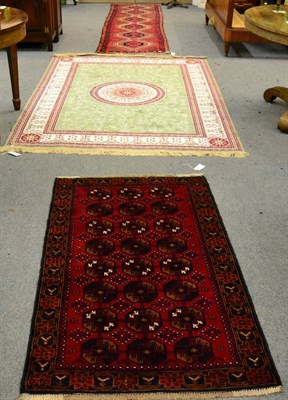 Lot 1283 - Turkmen rug, North Afghanistan, the claret field with three rows of octagonal guls, 146cm by...