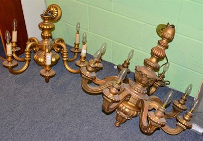 Lot 1286 - A carved gilt wood eight light chandelier together with another similar smaller example (2)