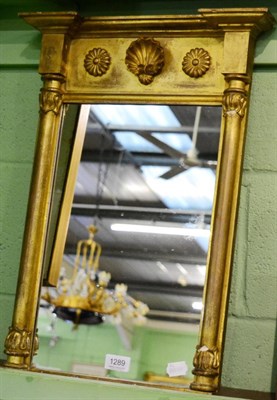 Lot 1289 - A small early 19th century gilt pier mirror, with shell and flower head decoration, 57cm x 41cm