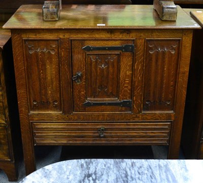 Lot 1291 - A joined oak cupboard, late 19th/early 20th century, carved overall with quatrefoil carving,...