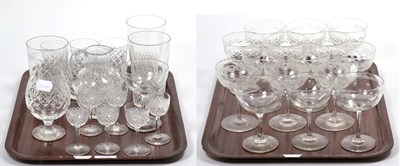 Lot 23 - A set of six cut glass champagne saucers; six further engraved examples; and four start cut...