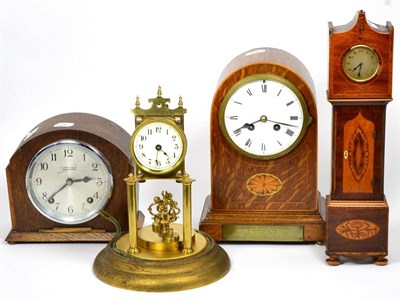 Lot 27 - An inlaid striking mantel clock, a miniature longcase clock mantel timepiece, 1930's mantel...