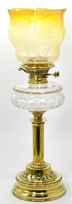 Lot 41 - An oil lamp with yellow shade