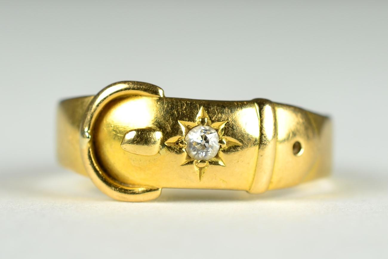 Lot 52 - A diamond buckle ring, an old cut diamond star set to a buckle motif shank, estimated diamond...