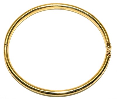 Lot 73 - A 9 carat gold bangle, measures 6cm by 5.2cm inner diameter