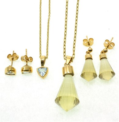 Lot 81 - A 9 carat gold smokey quartz pendant and earring suite, faceted smokey quartz drops to gold mounts