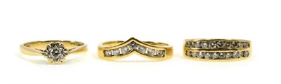Lot 82 - A 9 carat gold diamond band ring, channel set with two bands of round brilliant cut diamonds, total