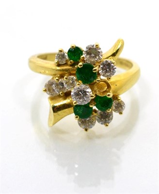 Lot 88 - An 18 carat gold emerald and diamond ring, vari-sized round brilliant cut diamonds and round...
