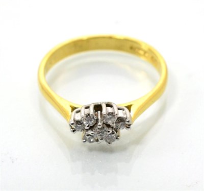 Lot 101 - An 18 carat gold diamond cluster ring, seven round brilliant cut diamonds in claw settings, to...