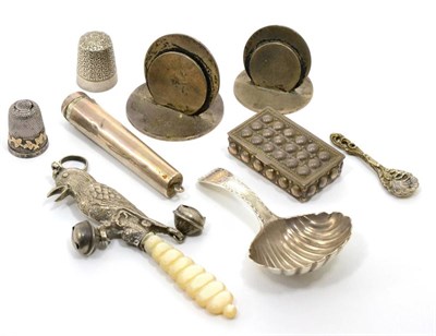 Lot 108 - A group of small silver items comprising:a George III bright engraved caddy spoon; a child's rattle