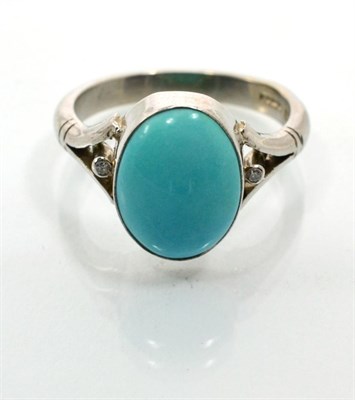 Lot 114 - An 18 carat white gold turquoise and diamond ring, an oval cabochon turquoise in a rubbed over...