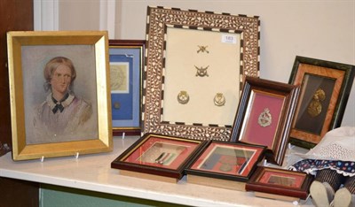 Lot 183 - Militaria in seven glazed displays, containing:- Australian Peace Medallion 1919 with shoulder...