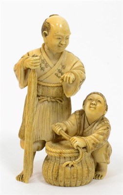 Lot 198 - A Japanese Meiji period carved ivory okimono