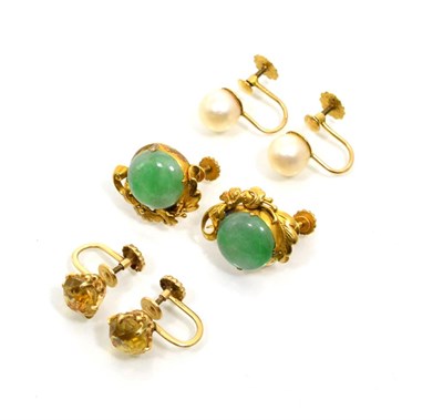 Lot 230 - A pair of jade earrings, round cabochon jade to a foliate scroll half frame, measure 1.5cm in...