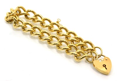 Lot 233 - A 9 carat gold curb link bracelet, with a 9 carat gold padlock claps, length 19cm