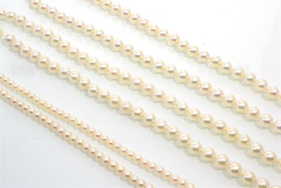 Lot 241 - A cultured Akoya pearl necklace, uniform pearls knotted to an 18 carat white gold clasp, length...